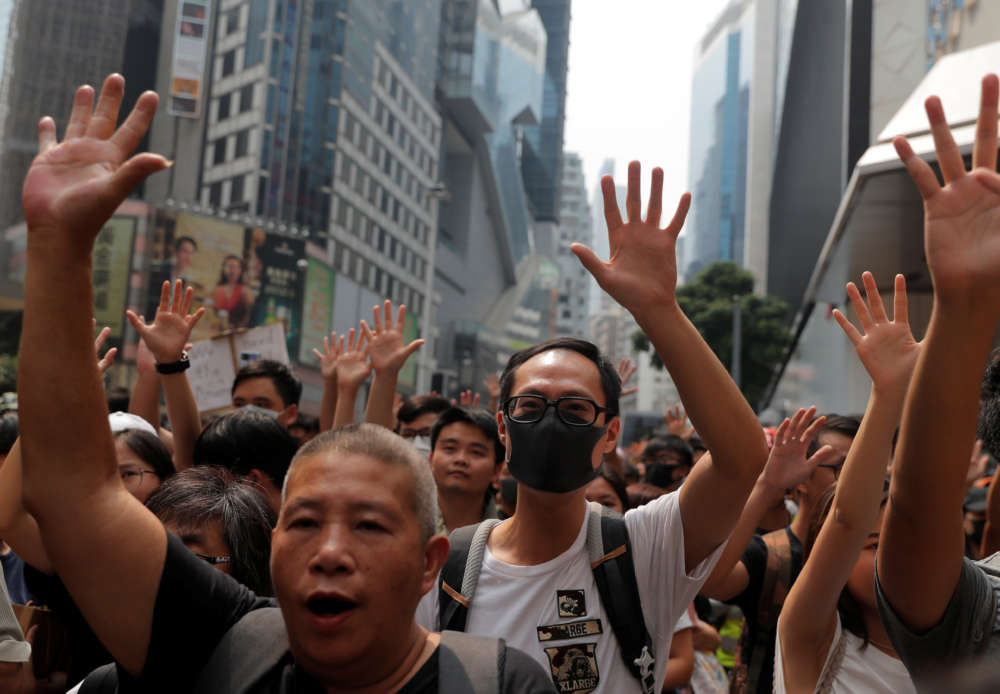 Scuffles break out at Hong Kong protest taking aim at Chinese traders