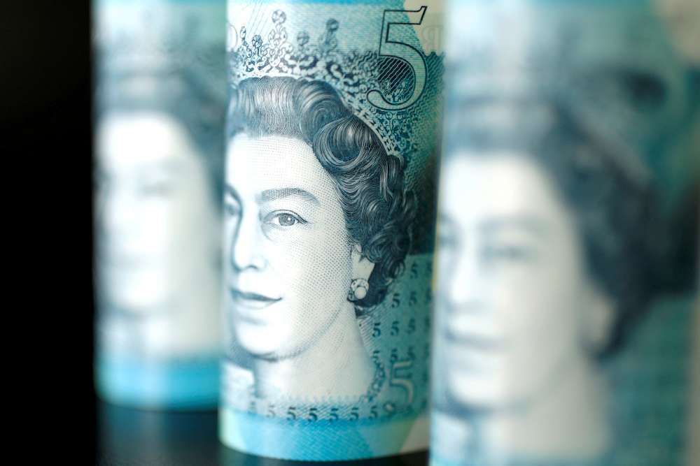 Sterling rises above $1.29 after strong UK jobs data