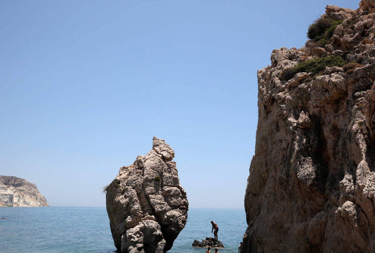 People Enjoy The Sea At Petra Tou Romiou (romios' Stone) Beach, Which According To The Myth It Is The Birthplace Of Aphrodite, The Ancient Greek Goddess Of Love And Beauty, Near Paphos