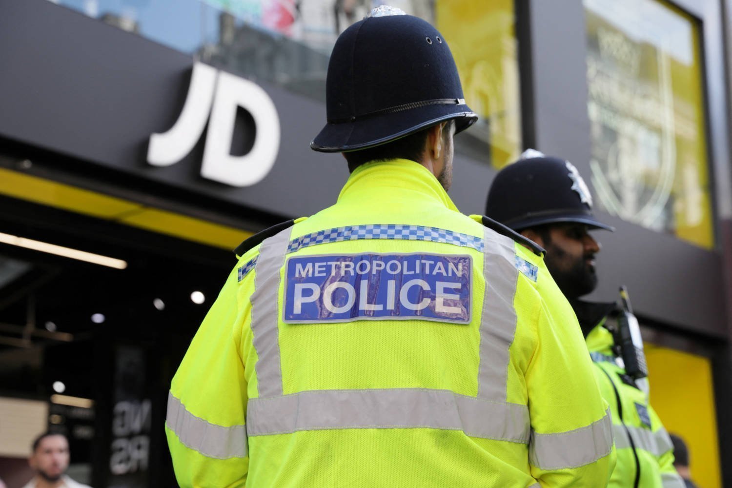 Police Officers Keep Watch As Disruptors Are Expected To Target Shops During A Shoplifting Spree Flash Mob On Oxford Street In London