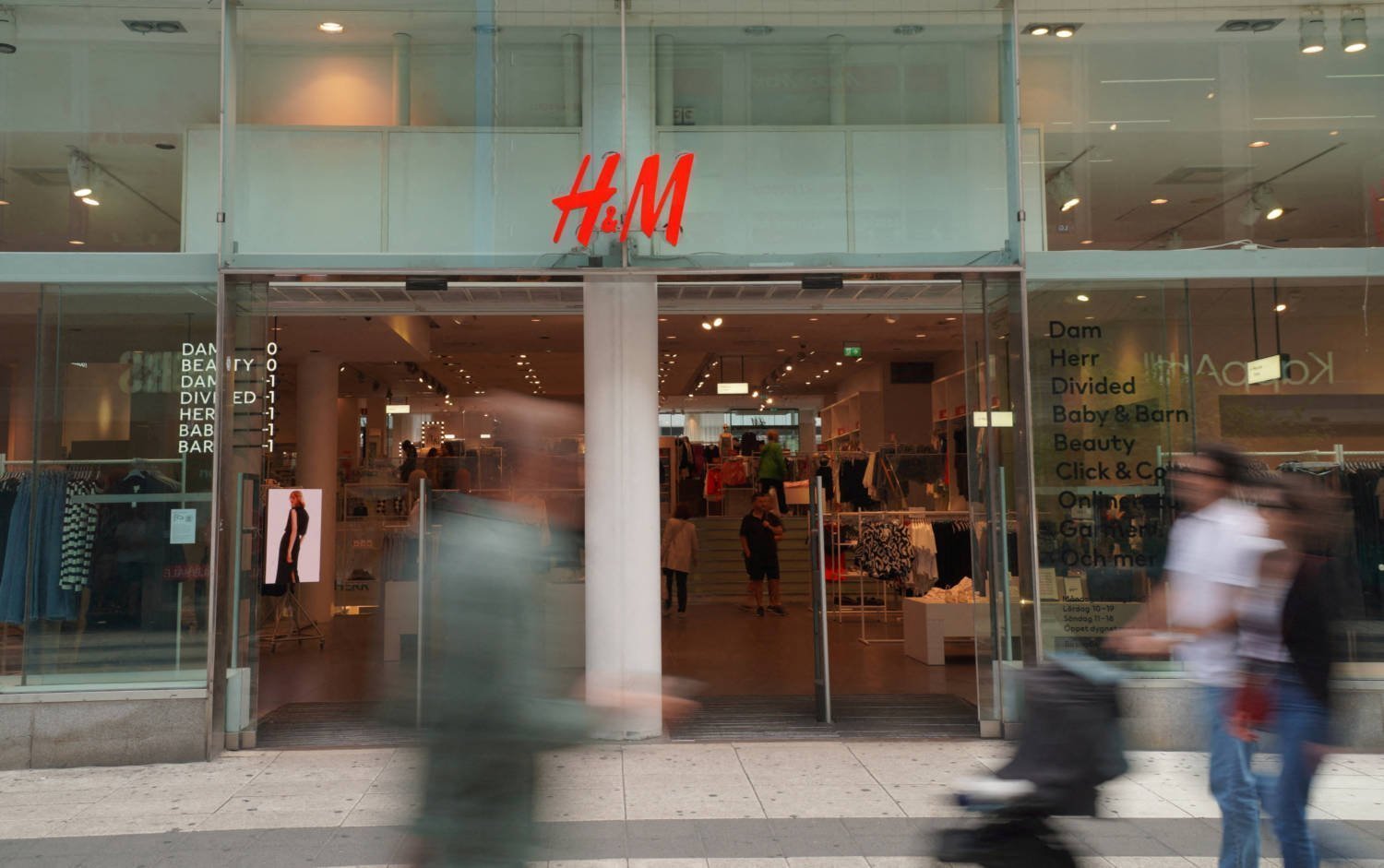 File Photo: Pedestrians And Shoppers Walk Past A Branch Of Fashion Retailer H&m In Central Stockholm