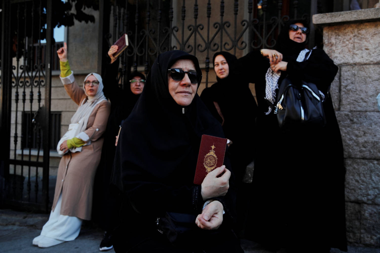 Protesters Hold Copies Of The Koran As They Demonstrate Outside The Consulate General Of Sweden In Istanbul