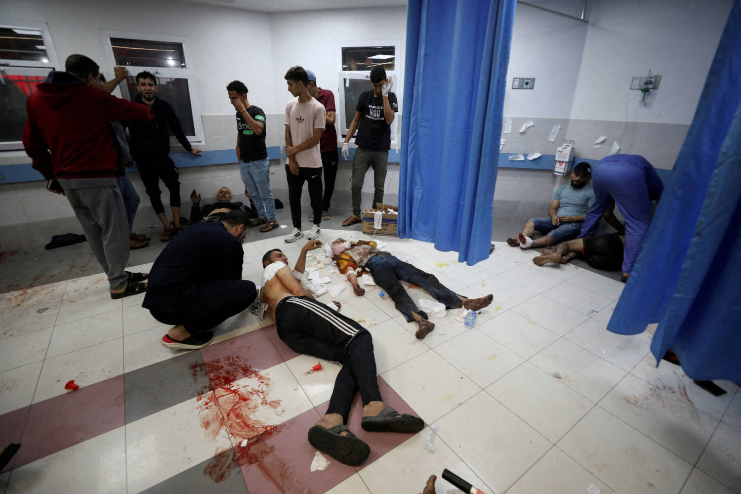 People Are Assisted At Shifa Hospital After Hundreds Of Palestinians Were Killed In A Blast At Al Ahli Hospital In Gaza That Israeli And Palestinian Officials Blamed On Each Other