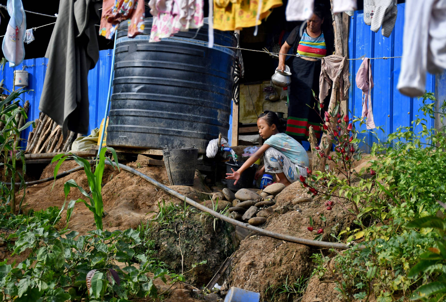 Sunneihmawii, 12, A Girl Who Fled Myanmar With Her Family, Washes Clothes In A Relief Camp At The Border Village Of Zokhawthar