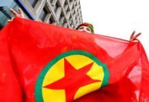 File Photo: A Woman Holds A Flag Of The Pkk During A Demonstration Against Turkish President Tayyip Erdogan In Central Brussels