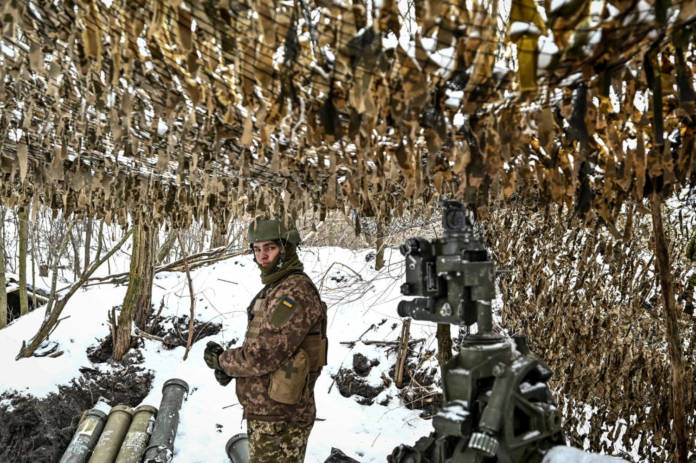 A Ukrainian Serviceman Stands Next To A M777 Howitzer At A Position Near A Front Line In Zaporizhzhia Region