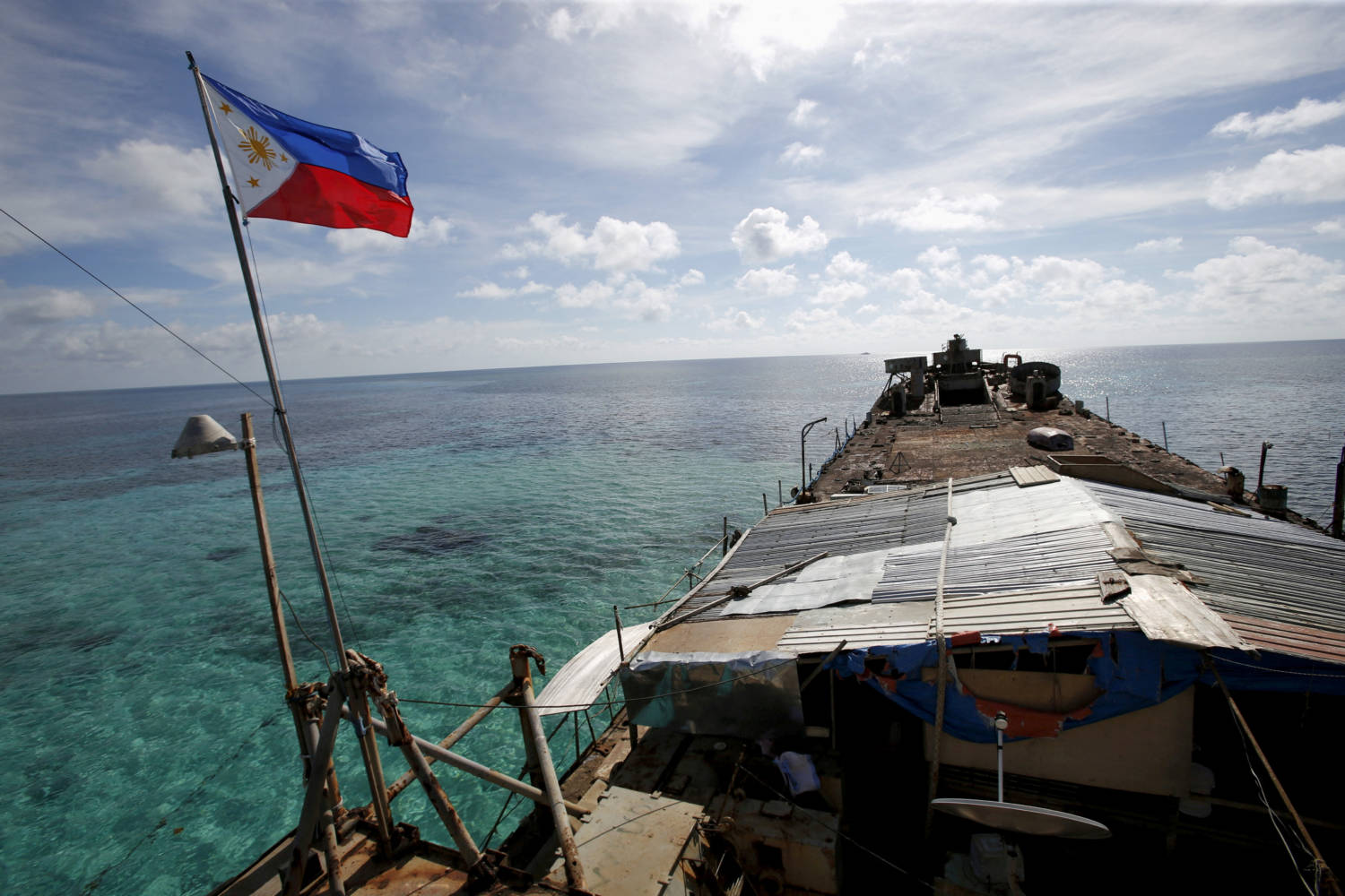 File Photo: A Philippine Flag Flutters From Brp Sierra Madre, A Dilapidated Philippine Navy Ship That Has Been Aground Since 1999 And Became A Philippine Military Detachment On The Disputed Second Thomas Shoal
