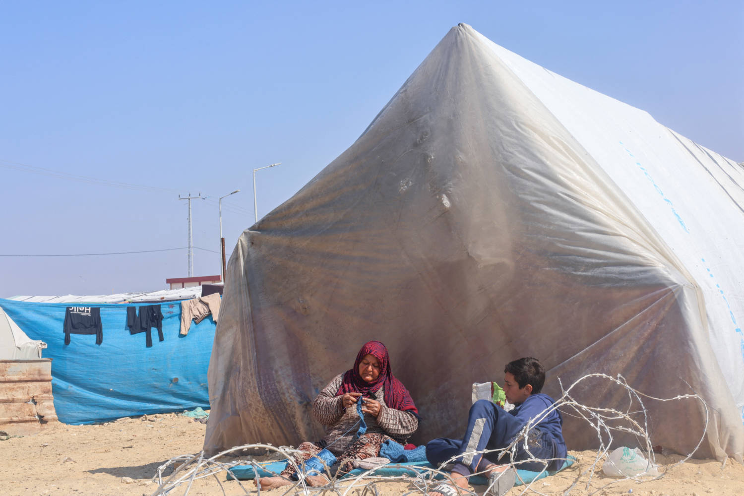 Gaza Woman Knits Free Wool Clothes For Displaced Palestinians To Stay Warm In Winter