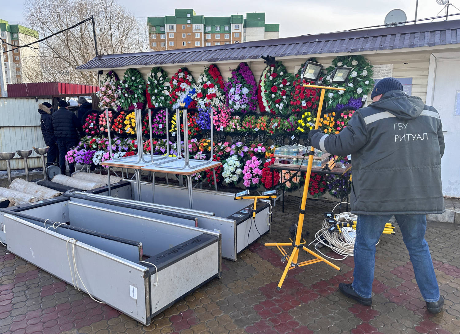 A Staff Works Next To Metal Detectors At The Borisovskoye Cemetery In Moscow