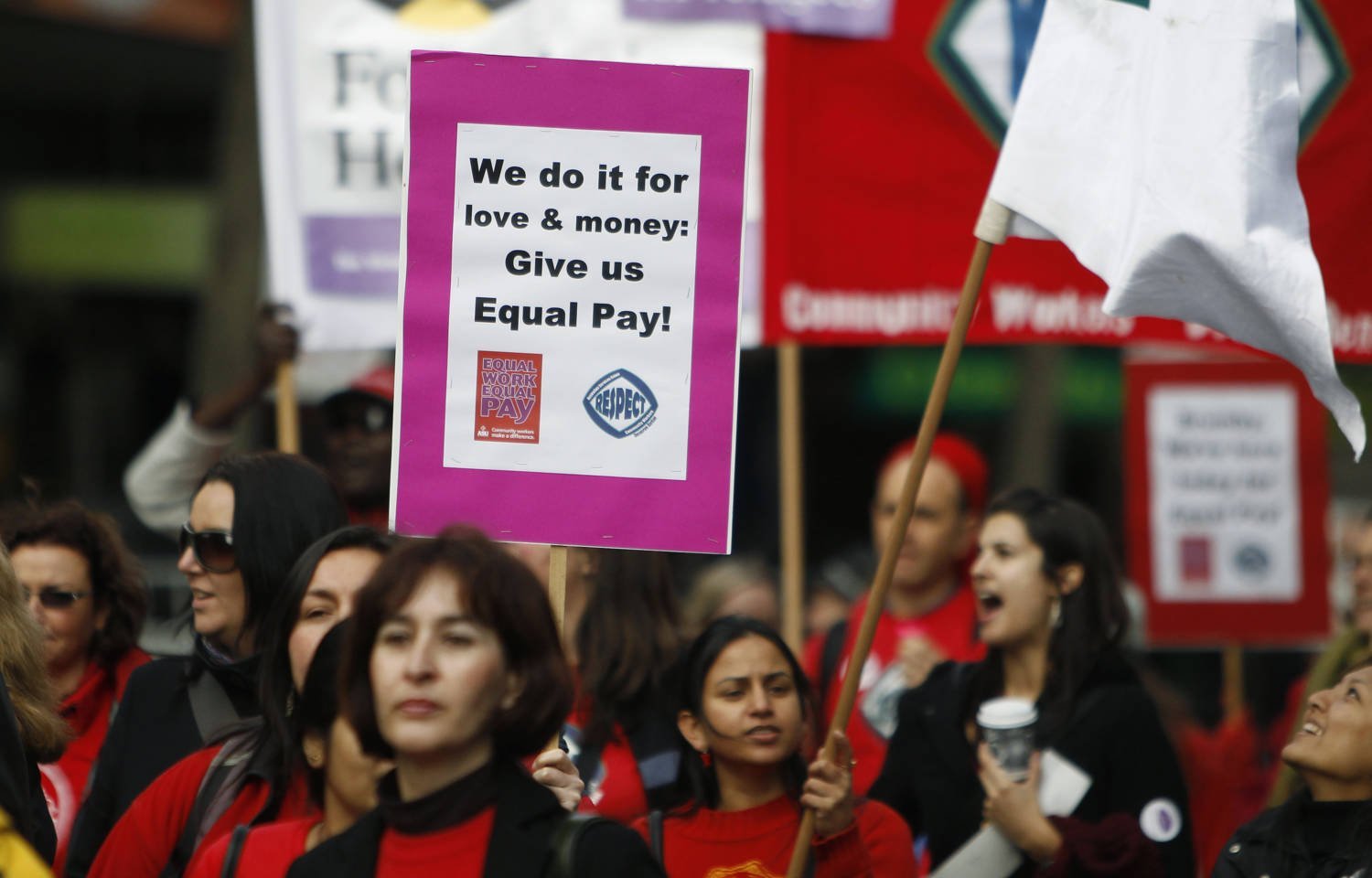 Women Workers Hold Up A Sign Demanding Equal Pay During A Protest In Melbourne