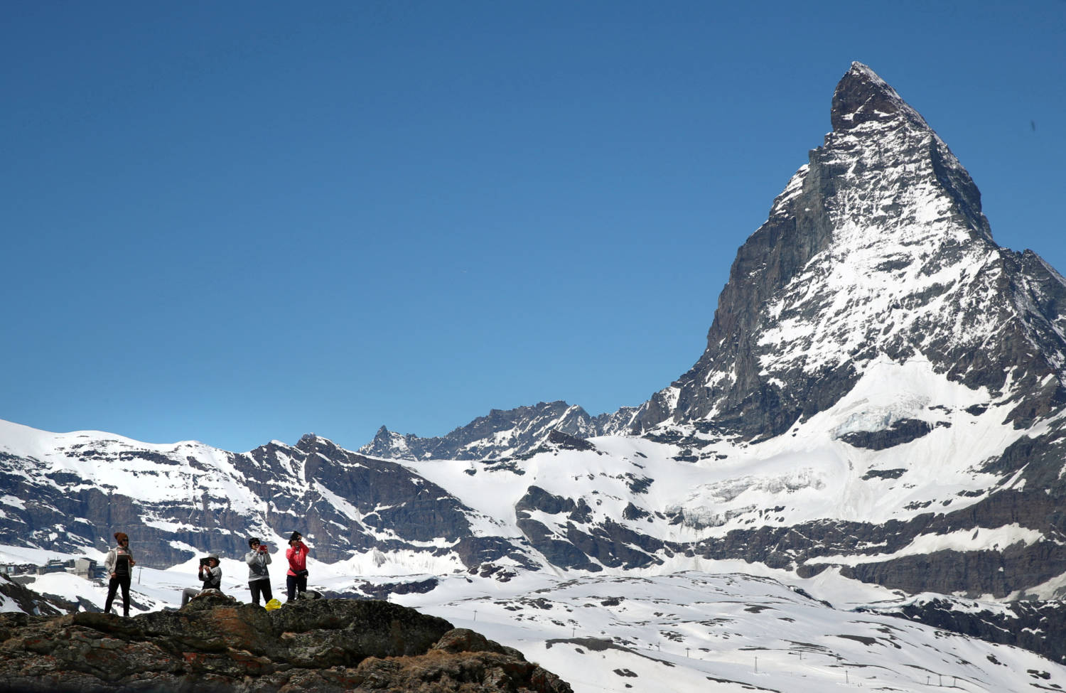 File Photo: Tourists Take A Picture In Front Of The Matterhorn Mountain At The Gornergrat In Zermatt