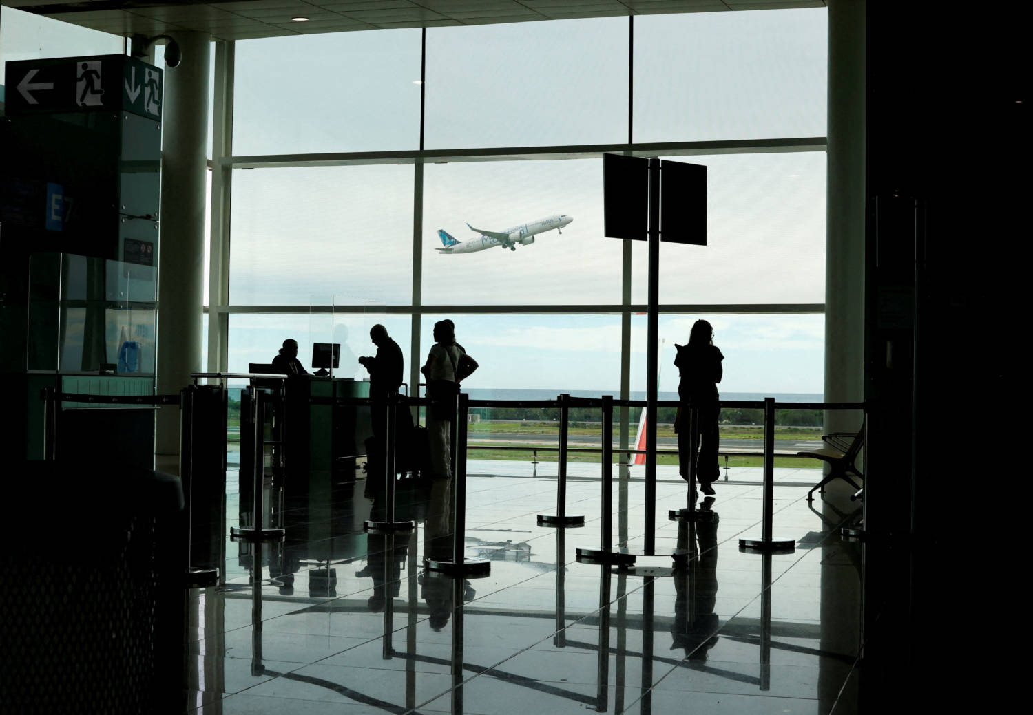 File Photo: People Watch As A Plane Takes Off At Josep Tarradellas Barcelona–el Prat Airport, Spain