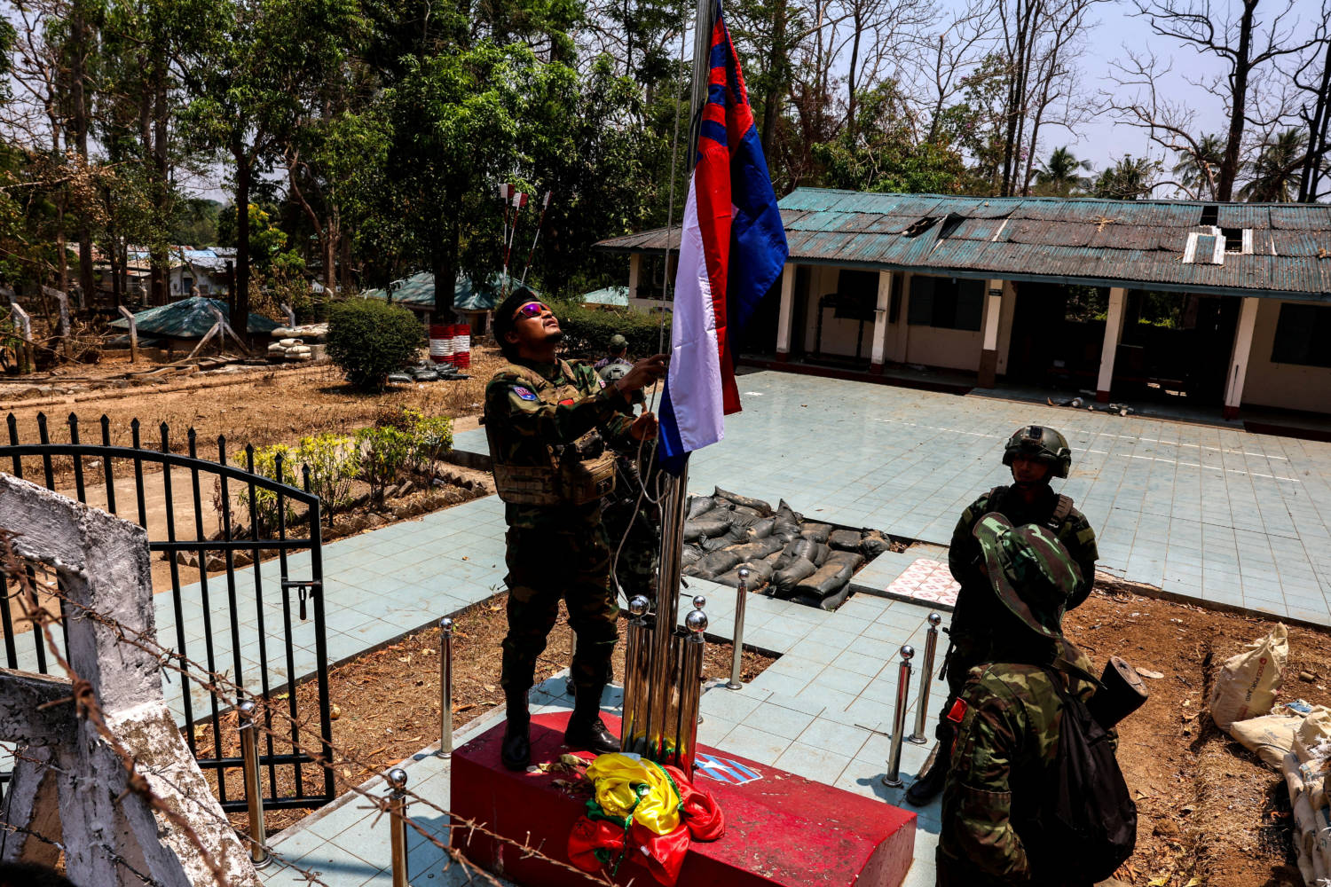 File Photo: Lt Saw Kaw, A Soldier Of The Karen National Liberation Army (knla) In Charge Of The Cobra Column, Raises Karen's National Flag After Burning Myanmar's National Flag At A Myanmar Military Base On The Outskirts Of Myawaddy