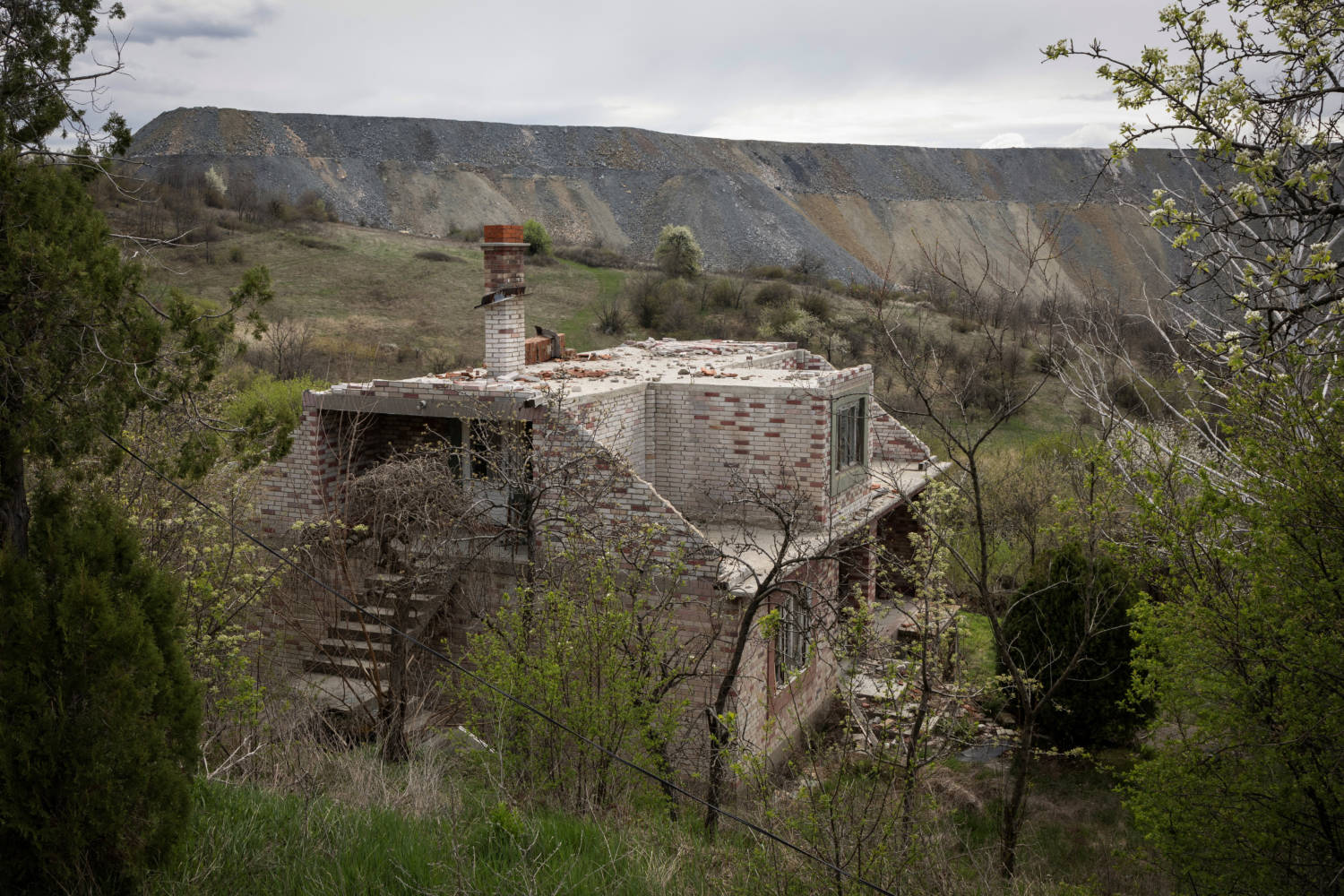 The Wider Image: In Serbian Village, Women Fight To Escape Encroaching Mine