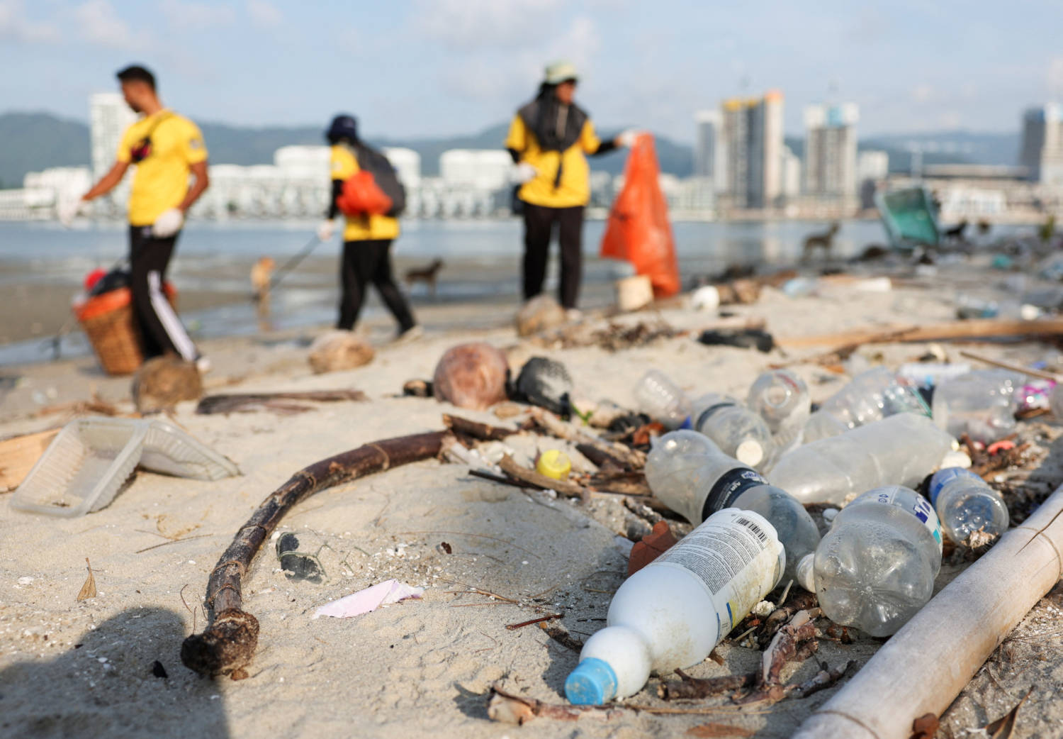 Volunteers Clean Up Beaches To Celebrate Earth Day In Malaysia
