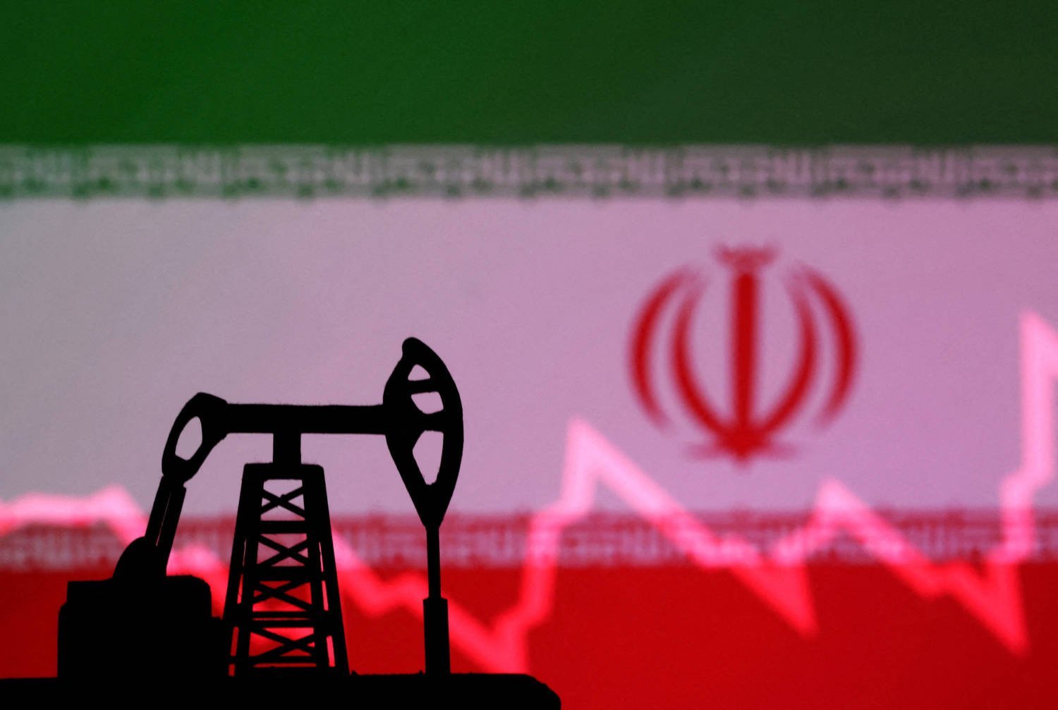 File Photo: Illustration Shows Iran Flag, Oil Pump Jack And Stock Graph