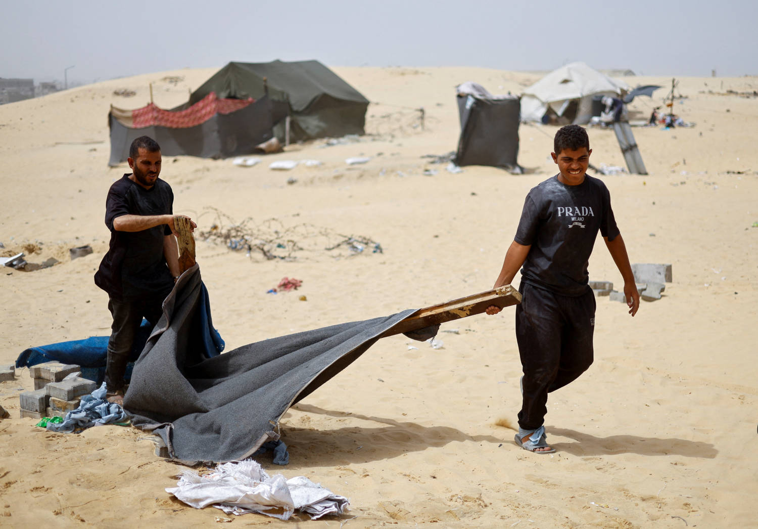 Palestinians Flee Rafah Following A Nearby Israeli Strike On An Area Designated For Displaced