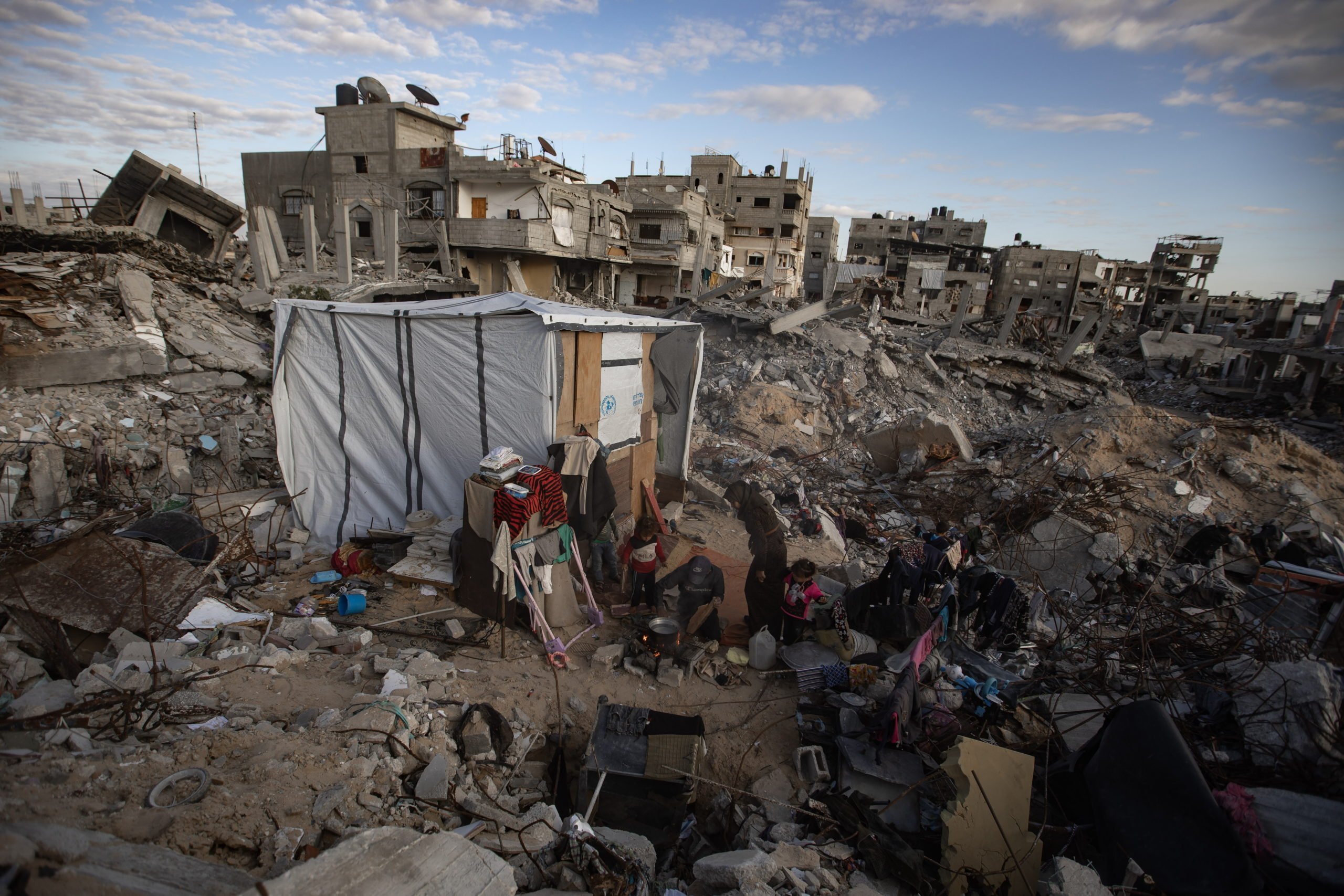 Palestinian Family Living In A Tent On The Rubble Of Their House In Khan Yunis