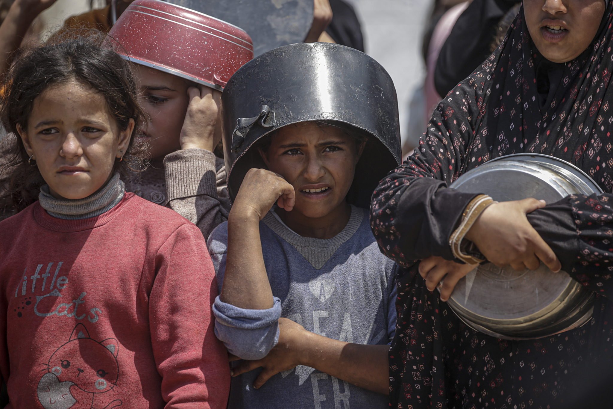 Displaced Palestinians Collect Donated Food In Jabalia, Northern Gaza