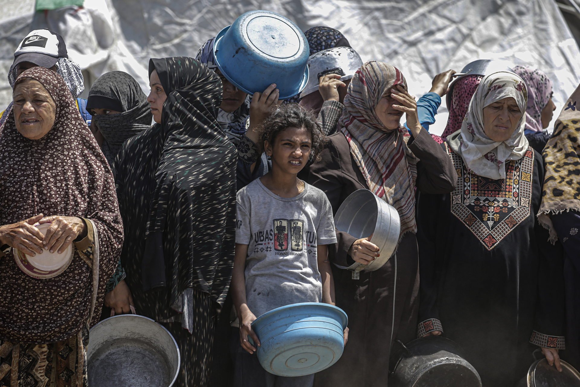 Displaced Palestinians Collect Donated Food In Jabalia, Northern Gaza