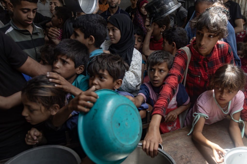 Hundreds Of Gazans Wait For Food At Charity Kitchen