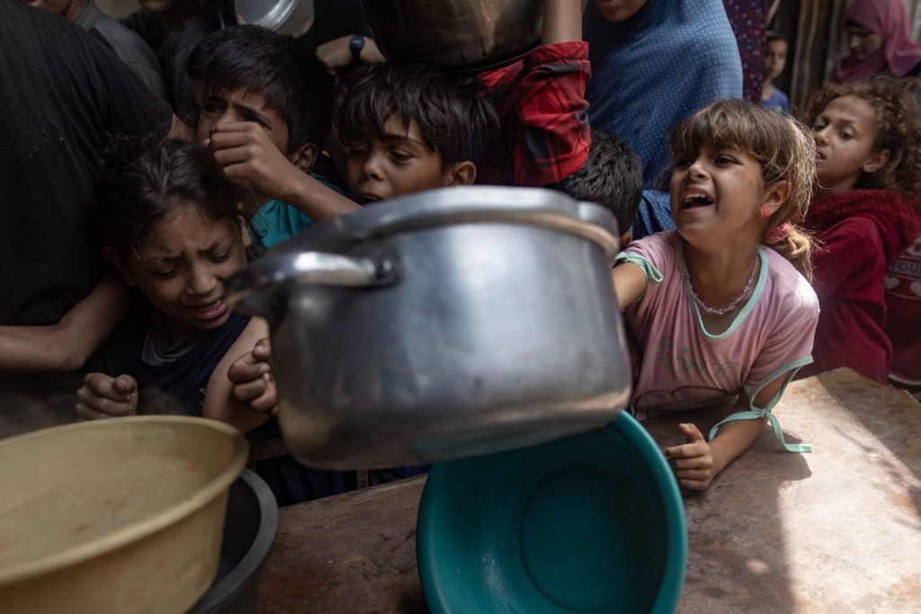 Hundreds Of Gazans Wait For Food At Charity Kitchen