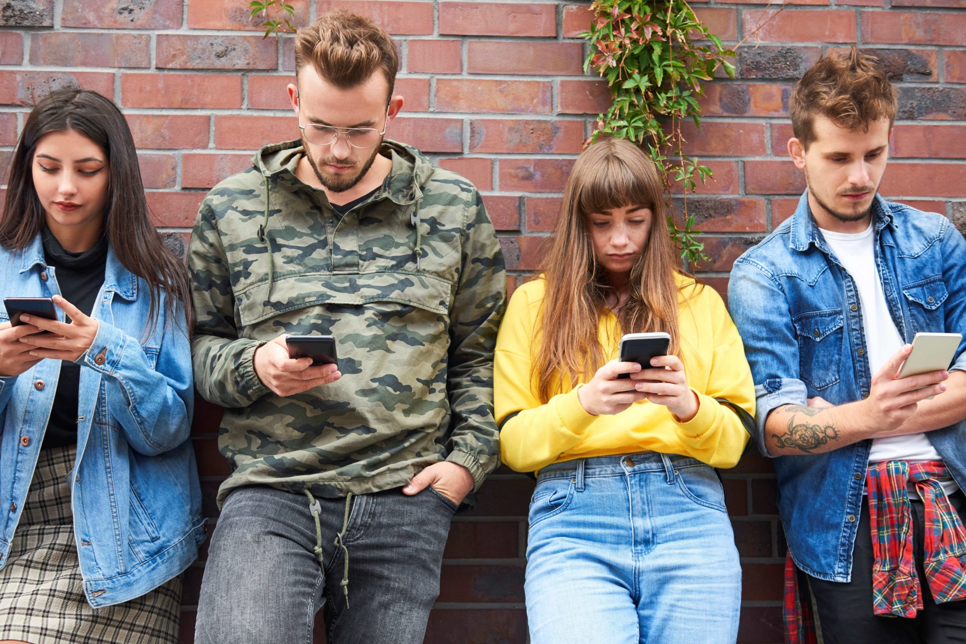Front View Two Young Couples With Mobile Phone