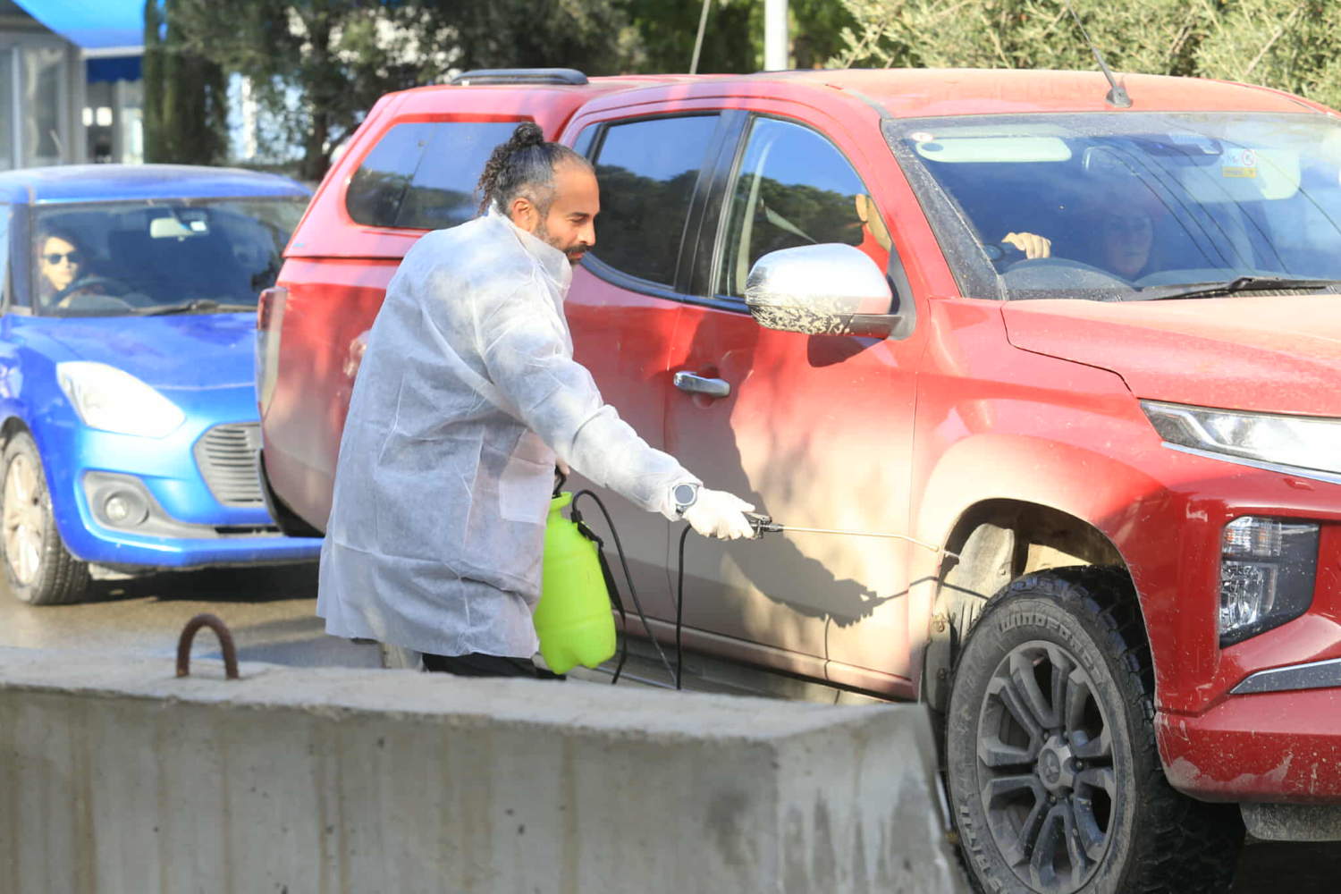 Vehicle disinfection steps up at Nicosia checkpoint amid foot-and-mouth ...