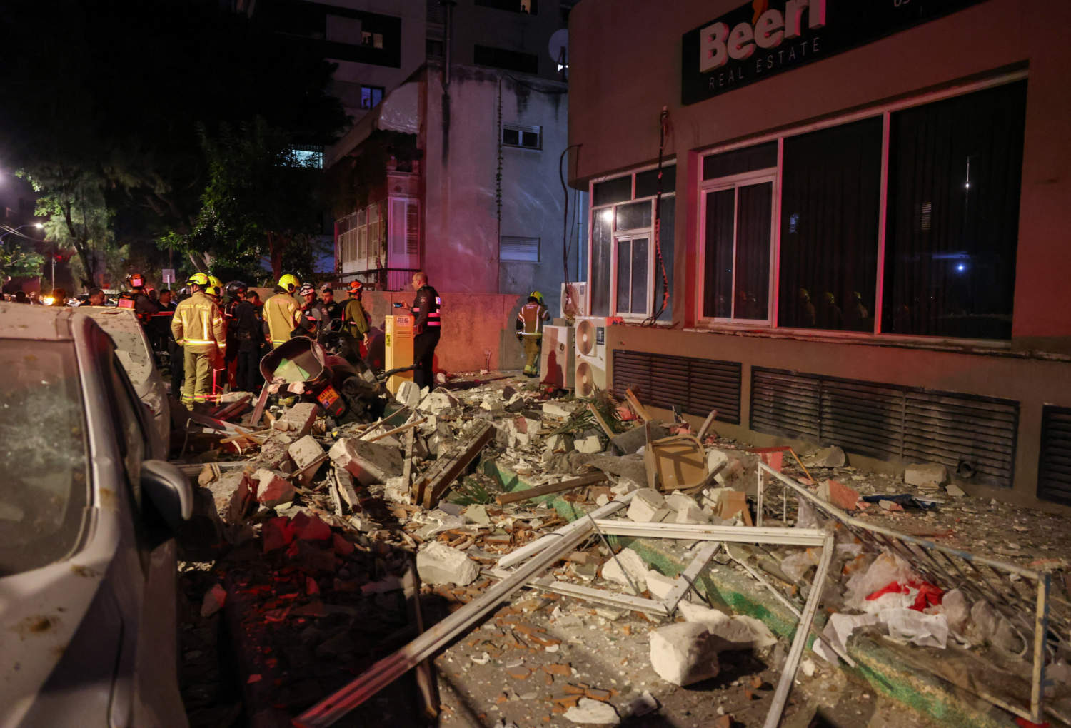 Emergency Personnel Inspect Damage In A Building Following An Iranian Projectile Strike, Amid The U.s. Israeli Conflict With Iran, In Central Israel