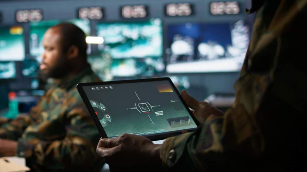 Army Telecommunication Systems Operator Using Satellite Software Tablet