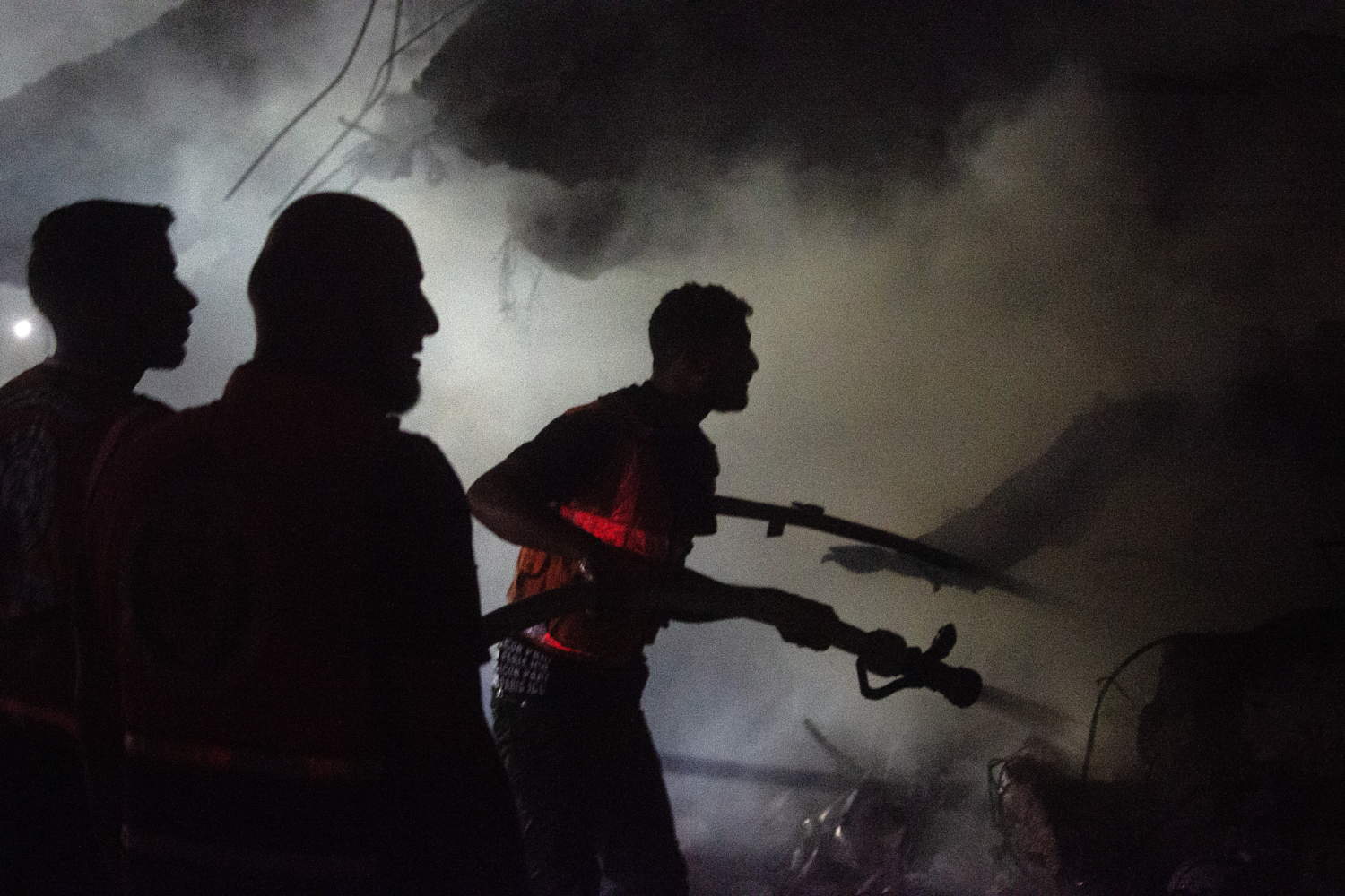 Palestinian Firefighters Battle Blaze After Israeli Airstrike In Gaza